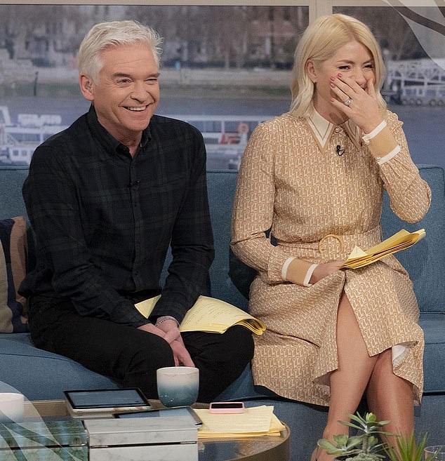 Philip admitted he had a secret affair with a younger male colleague on ITV show This Morning (pictured on set with Holly Willoughby) but strongly denies the grooming allegations