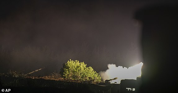 An Israeli mobile artillery unit fires a shell from northern Israel towards Lebanon, in a position near the Israel-Lebanon border, Monday, September 30, 2024. (AP Photo/Baz Ratner)