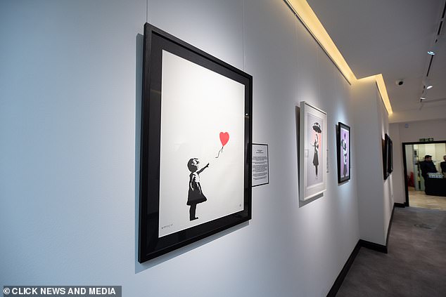 Banksy's Girl With Balloon print now sits in an inconspicuous office in the gallery, wrapped in a police bag, and the other artwork has been removed and placed in safe storage.