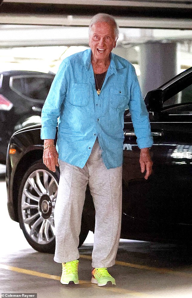 Boone, 90, wore a comfortable outfit when he was seen stepping out of his black Rolls Royce on Monday as he walked into an office building