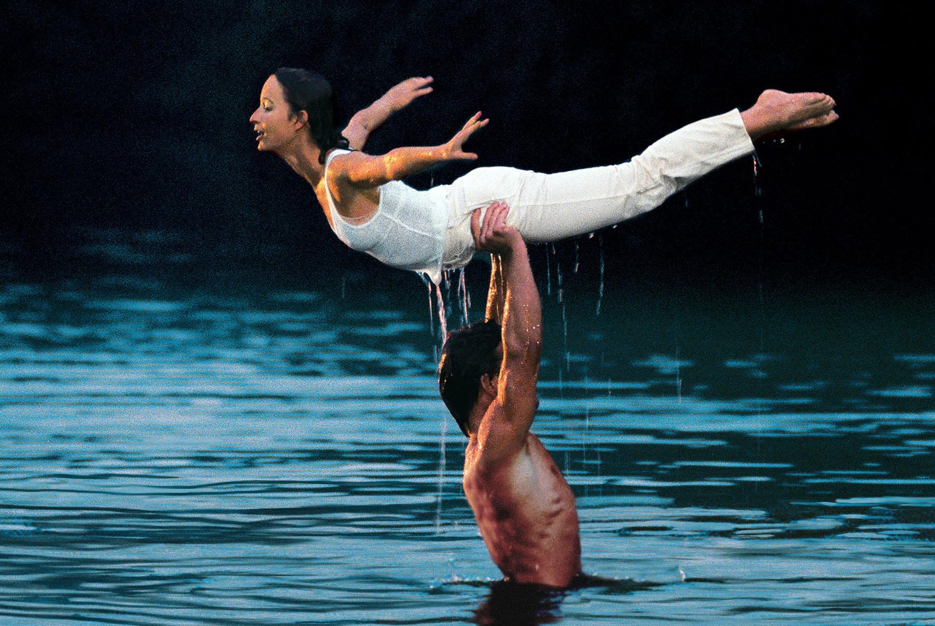 Patrick Swayze was shirtless and wet in a lake while holding Jennifer Gray over his head in Dirty Dancing