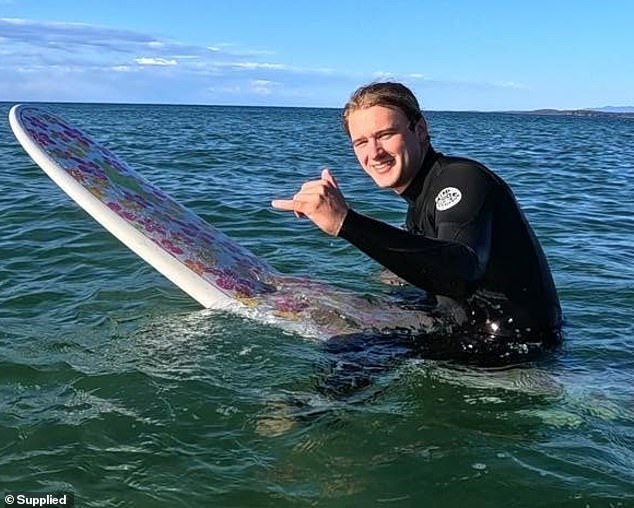 Murphy Shaw, 22, from Canberra (pictured) was surfing at South Broulee Beach in the morning when he saw the door of a plane crash down