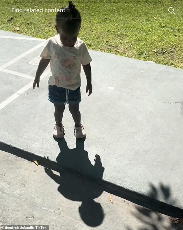 Adorable moment toddler two tries to run away from her