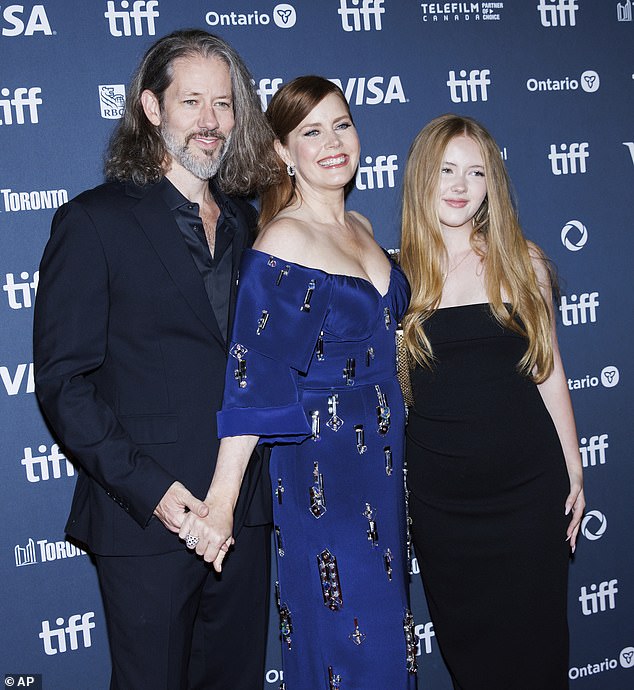 The trio beamed as they stayed close together on the red carpet