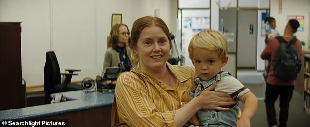 The trailer opens with Adams' character Mother adjusting to life as a suburban mom with her toddler son and husband (played by Scoot McNairy)