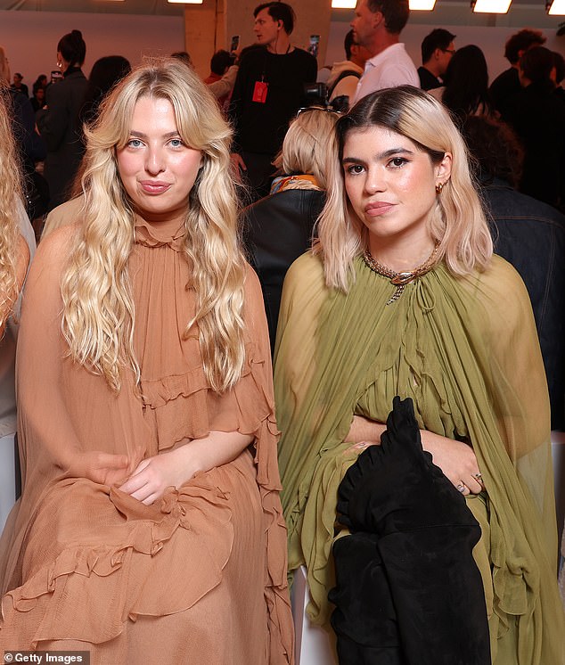 Anais Gallagher (left) and her cousin Molly appeared to be in good spirits as they reunited and sat front row at the Chloe show during Paris Fashion Week on Thursday