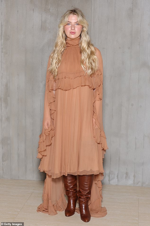 Anais, 24, the daughter of Noel Gallagher, looked effortlessly chic in a layered nude dress which she paired with brown leather over-the-knee boots