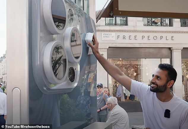 YouTuber Arun Maini shows off his creation outside the Apple Store in London: a blown-up version of an iPhone 15 Pro Max