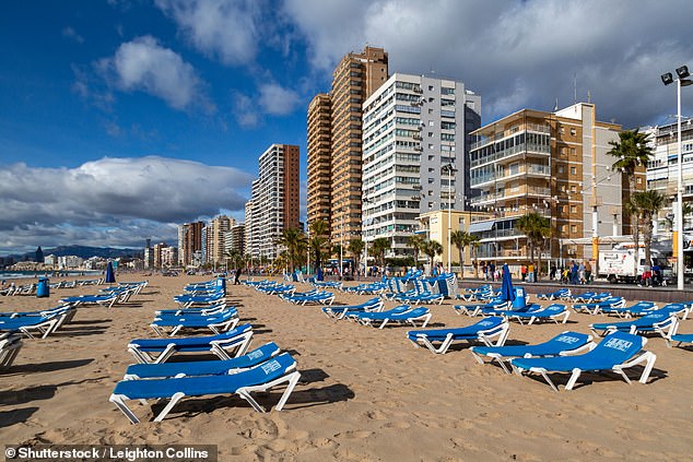 Hotels and sunbeds near Levante Beach in Benidorm, Spain