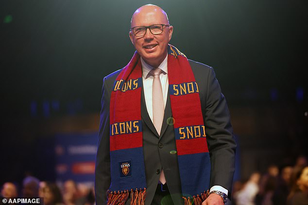 Opposition Leader Peter Dutton wore a Lions scarf (pictured) and made no secret of who he is barracking for at the MCG