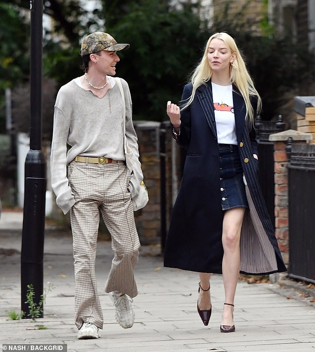 Anya Taylor-Joy showed off a long figure in a dark denim mini skirt as she stepped out with actor Logi Thorvaldsson in London on Tuesday morning