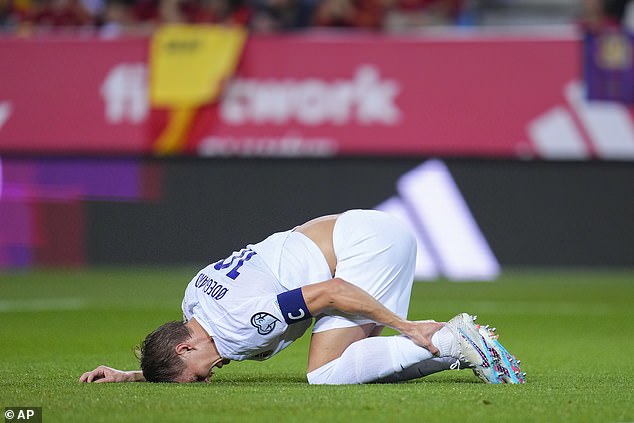 Odegaard held his ankle in pain after being cleared by Rodri in the penalty area