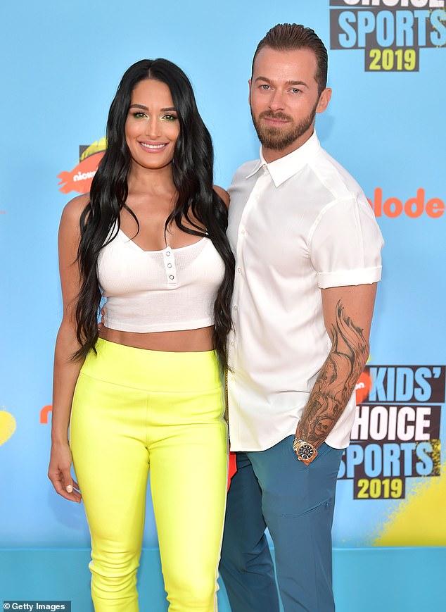 Artem Chigvintsev, 42, has updated his Instagram bio by re-adding his wife Nikki Garcia, 40,'s name after removing it; seen in 2019