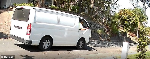 The CCTV footage, uploaded to Reddit, showed the driver slowing down as he held up a phone to take a photo of the mailbox (pictured)