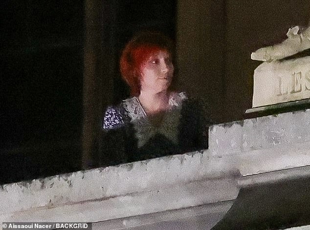 Lady Gaga, 38, was spotted Friday night and Saturday morning wearing a cropped red wig on a balcony at the famous French museum