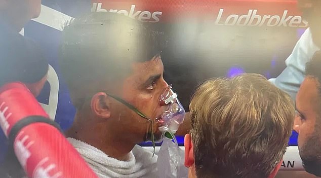 Hasnan was then treated by medics and required an oxygen mask after his shock defeat