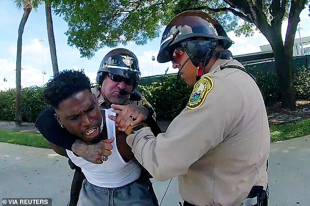 Bodycam footage showed NFL star Tyreek Hill being dragged from his $300,000 McLaren and placed in handcuffs