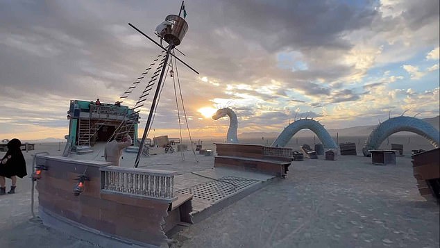 A Burning Man festival visitor suffered serious injuries, including a broken spine, after jumping 40 feet from a climbing frame