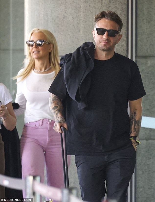 Carrie Bickmore and Tommy Little appeared to be in good spirits as they touched down together at Sydney Airport recently