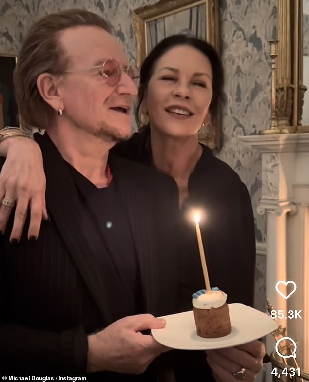 Catherine Zeta-Jones, 55, showcased her impressive singing as she joined unlikely friend Bono, 64, to serenade husband Michael Douglas, 80, at the couple's joint birthdays this week