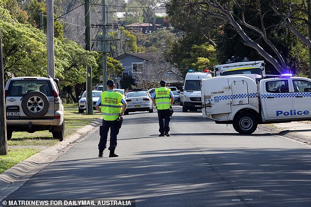 Police are seen outside the home in the Blue Mountains on Tuesday