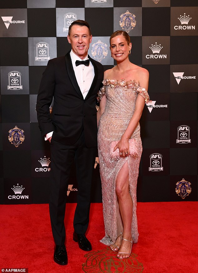 Collingwood coach Craig McRae proved once again that he is not only a leader on the football field, but also a star on the red carpet. Pictured with his wife Gabrielle