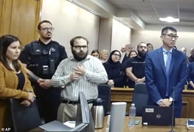 Ahmad Alissa is pictured in court Monday, shortly before he was sentenced for killing 10 people during a March 2021 massacre at a King Soopers supermarket in Boulder, Colorado