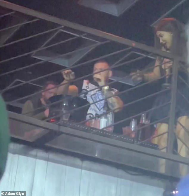 Conor McGregor (center) was spotted shadowboxing and dancing in the VIP section of a New York nightclub this week