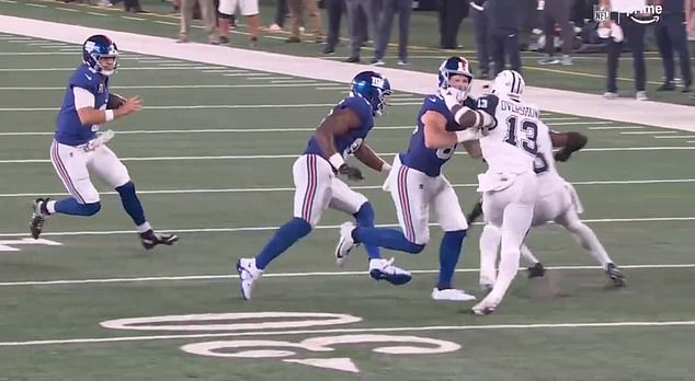 Giants tight end Daniel Bellinger is called for a face mask as his own grill is grabbed