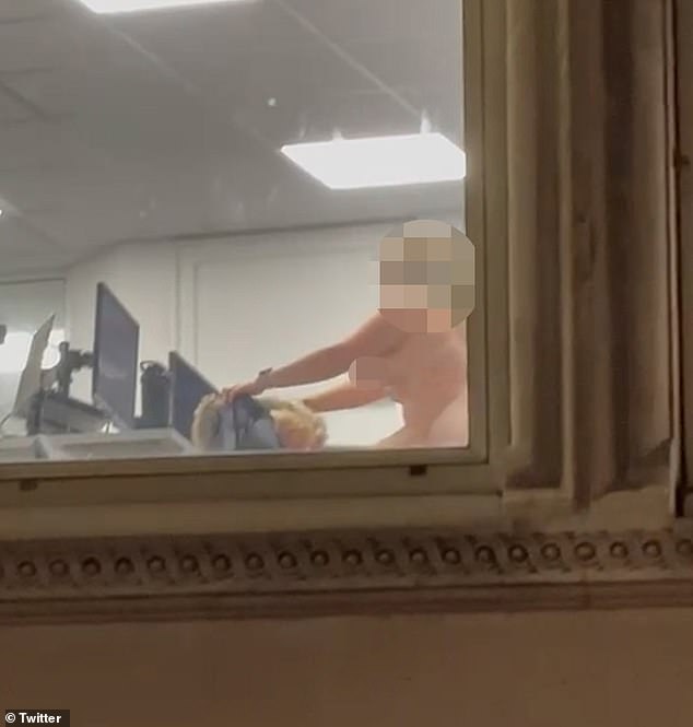 The hot video, filmed by a member of the public on the street below, shows a man and a woman having sex in an office chair on the first floor of an office in central London