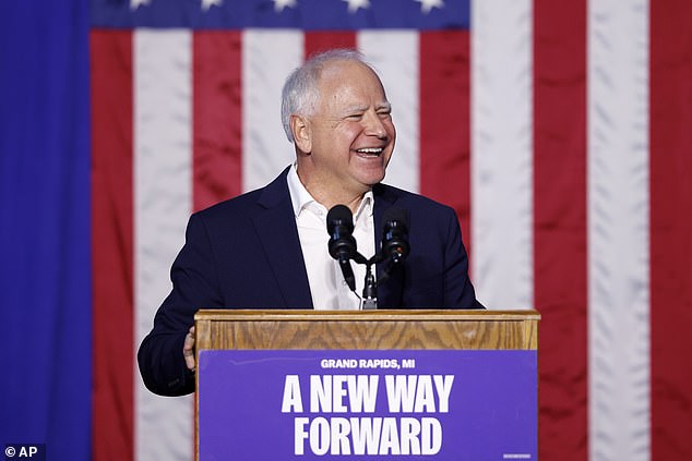 Democratic vice presidential nominee, Minnesota Gov. Tim Walz, laughed as a Michigan crowd chanted, 