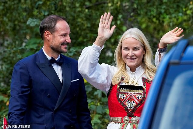 Senior members of the Norwegian Royal Family partied into the early hours this morning as they celebrated the controversial marriage of Princess Martha Louise to American shaman Durek Verrett. Pictured are Norway's Crown Prince Haakon and Crown Princess Mette-Marit reacting after Princess Martha Louise and Durek Verrett's wedding in Geiranger