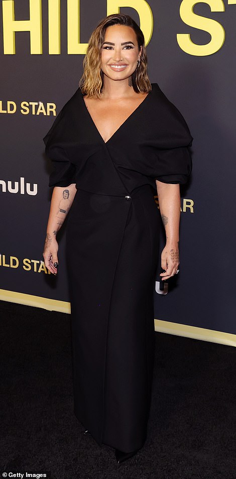 Demi Lovato beamed with pride as she arrived at the premiere of her new Hulu documentary Child Star in Los Angeles on Thursday night.