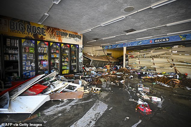 Debris is left behind at a flooded store after the storm hit Cedar Key Thursday evening