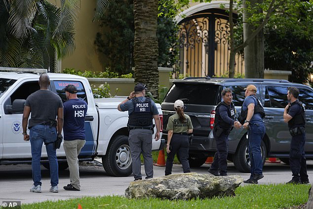 Police and officers are seen around Diddy's Miami home in March after conducting raids