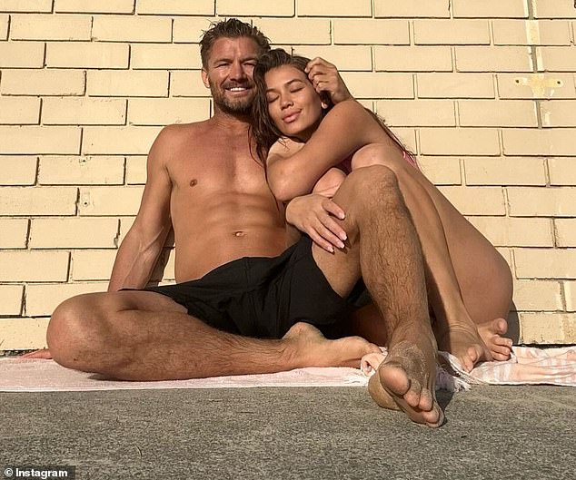 Brett Finch's estranged wife Ellie Johnston has introduced her new partner Liam Hillen (pictured together) in a series of revealing posts on Instagram