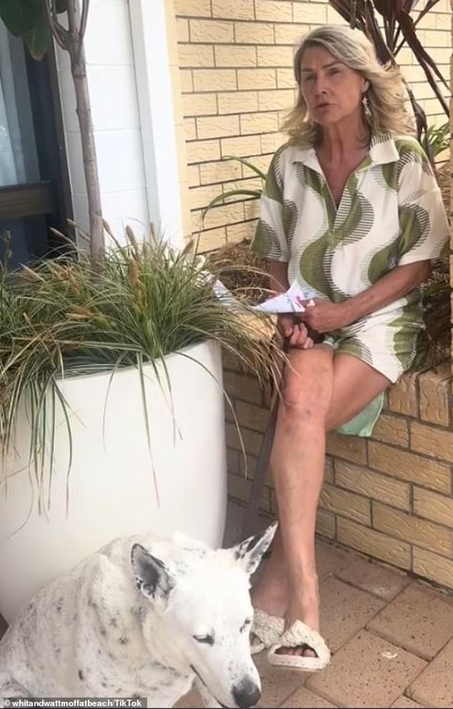 Retailer Robyn had stepped outside her store for a coffee break and her dog was standing at her feet, wearing a collar and leash. But because the leash rested on Robyn's foot and not in her hand, she was fined a whopping $806 (photo shop owner Robyn and her deaf dog Violet.