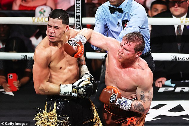 Canelo Alvarez (right) lands a huge right hook on opponent Edgar Berlanda in Vegas