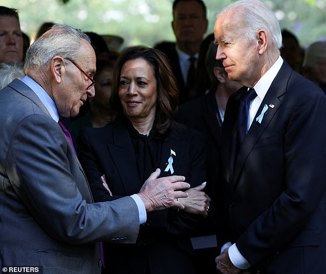 Senate Majority Leader Chuck Schumer (D-NY) appears to extend his arm for a handshake as he addresses President Joe Biden at a 9/11 memorial ceremony as Vice President Kamala Harris looks on