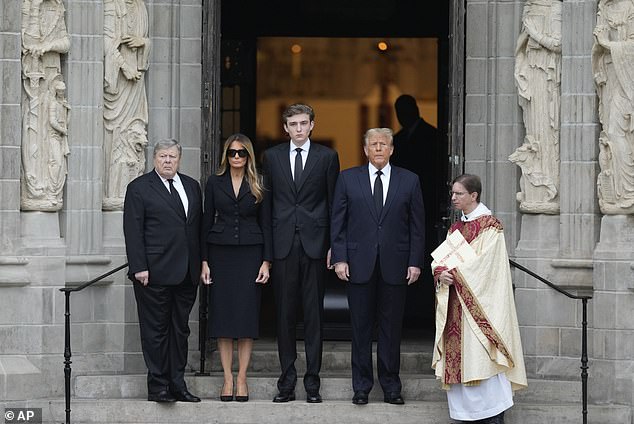 Former President Donald Trump, second from right, his wife Melania, second from left, their son Barron, center, and father-in-law Viktor Knavs, left, stand outside Bethesda-by-the-Sea Church at the start of the funeral of Amalija Knavs, the former first lady's mother, in Palm Beach, Florida, Thursday, Jan. 18, 2024