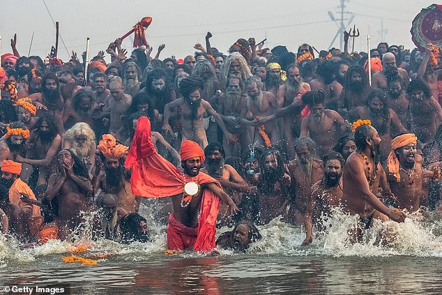 Naga sadhus enter to bathe in the waters of the holy Ganges during the Maha Kumbh Mela festival in India in 2013 (file photo)