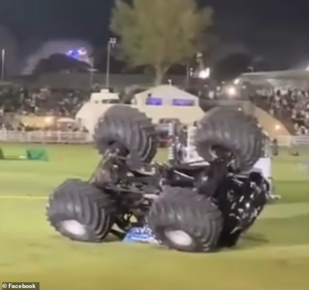 A blue monster truck flipped over on its roof after it failed to land (photo)