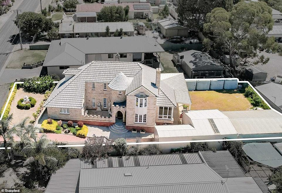 This unique two-storey white stone masterpiece is unlike any other, embodying a whimsical presence amidst manicured lawns and modern homes in Port Lincoln, South Australia