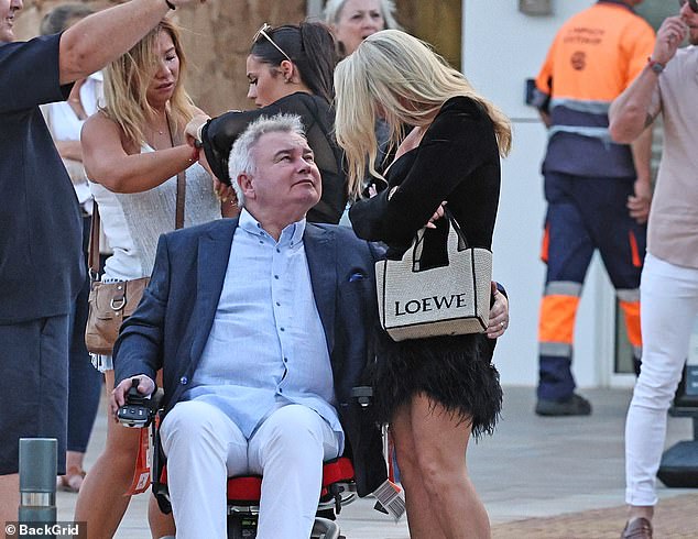 Eamonn Holmes proved he was thoroughly enjoying his new romance with girlfriend Katie Alexander when he cheekily grabbed her bum during a romantic holiday