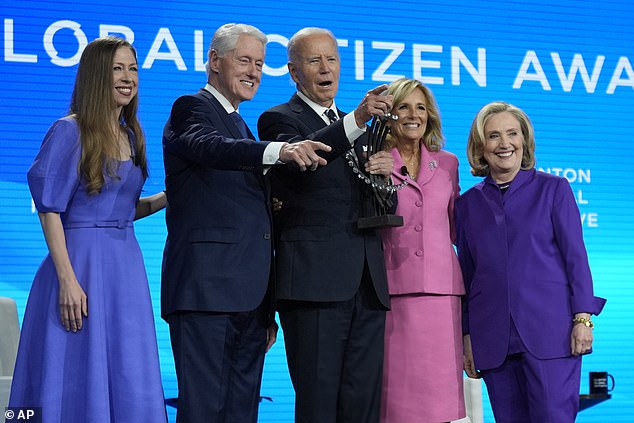 President Joe Biden and first lady Jill Biden pose for a photo after he receives the Global Citizen Award from former President Bill Clinton, Chelsea Clinton and former Secretary of State Hillary Clinton during the Clinton Global Initiative