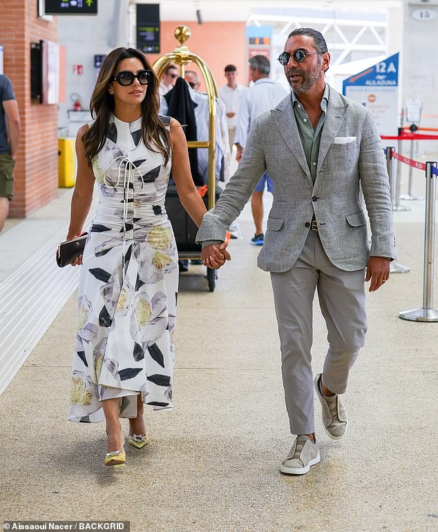 Eva Longoria looked effortlessly elegant in a floral dress for her flight to the airport as she landed at Venice's Marco Polo Airport on Sunday, hand-in-hand with her husband Jose Baston