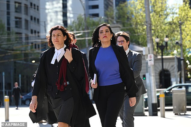 Independent MP Moira Deeming (centre, in blue top) arrives at the Federal Court of Australia in Melbourne, Wednesday, September 18, 2024