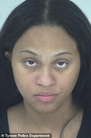 Kinaya Willis, 25, the daughter of Fulton County District Attorney Fani Willis, is pictured in her arrest photo after she was arrested last month in Tyrone, Georgia, for driving on a suspended license.