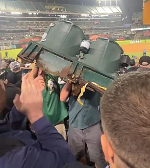 Fan lifts chairs from Oakland Coliseum