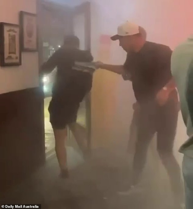 Braith Anasta (pictured right) stopped a man as he tried to leave a pub in Sydney on Friday night after he appeared to deliberately set off a fire extinguisher